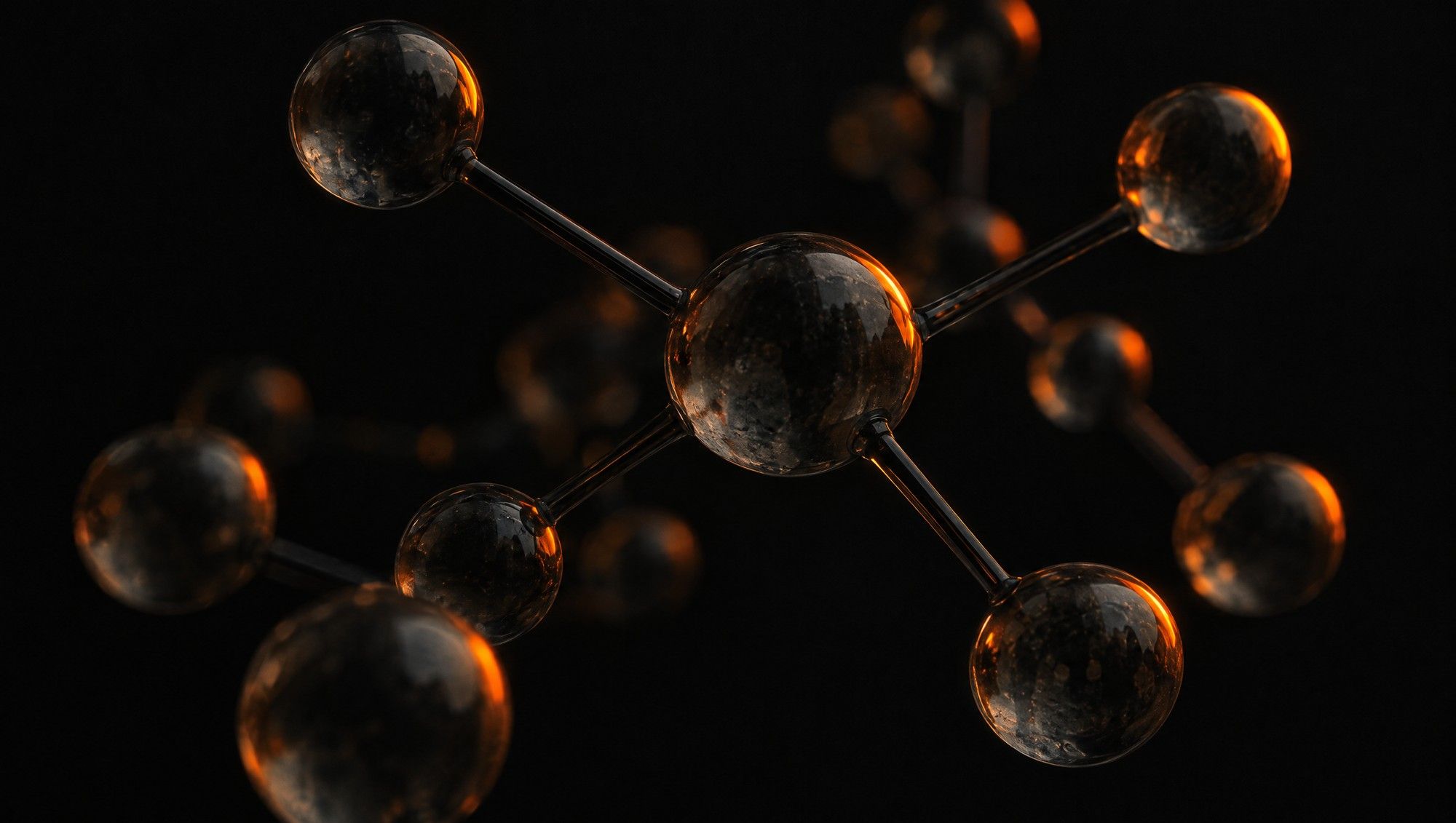 A ball-and-stick molecular model made of smoky glass spheres and dark rods, floating against black with orange edge light.