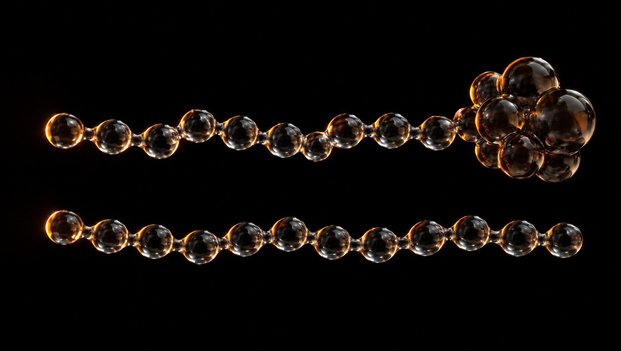 Two horizontal chains of clear glass beads floating on a black background, lit from the left by an orange rim light; the upper chain ends in a cluster of larger glass beads, the lower chain does not.